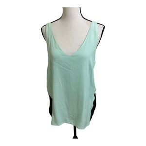 Ayres double v neck blouse with black sheer side inserts. Size medium.